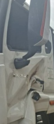 NX TRACTOR – DAMAGED DOORS AND BUMPER