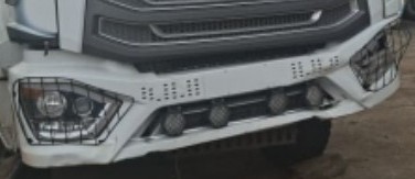 NX TRACTOR – DAMAGED DOORS AND BUMPER